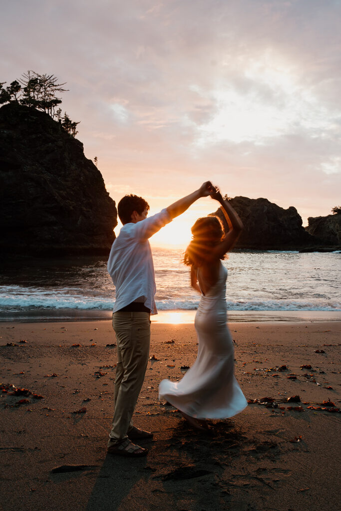 Couple on the Oregon Coast beaches at sunset