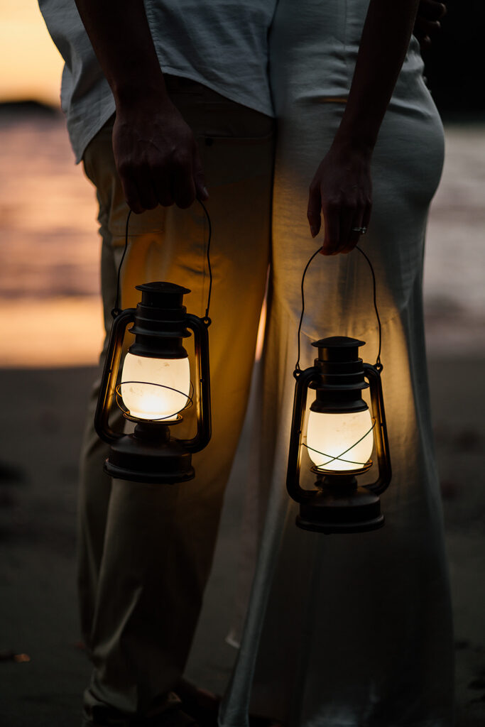 Couple walks with lanterns at Samuel H Boardman, Oregon Coast at blue hour