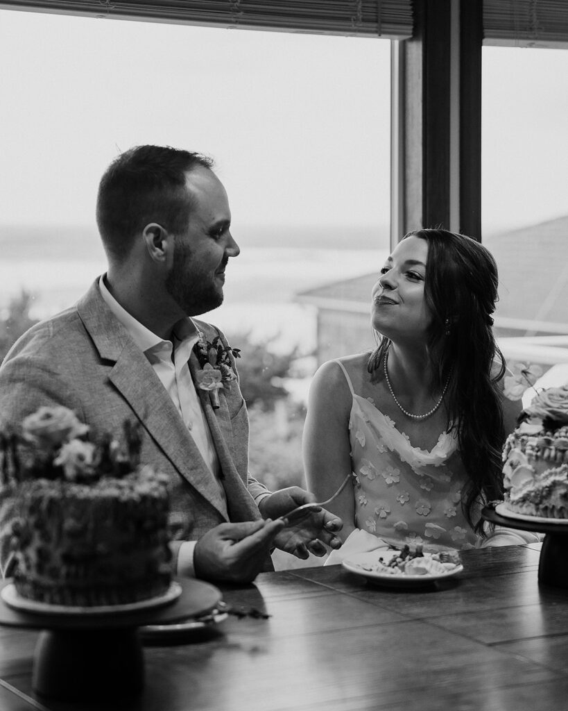 Bride and groom cut their personal cakes after an emotional Cannon Beach wedding ceremony