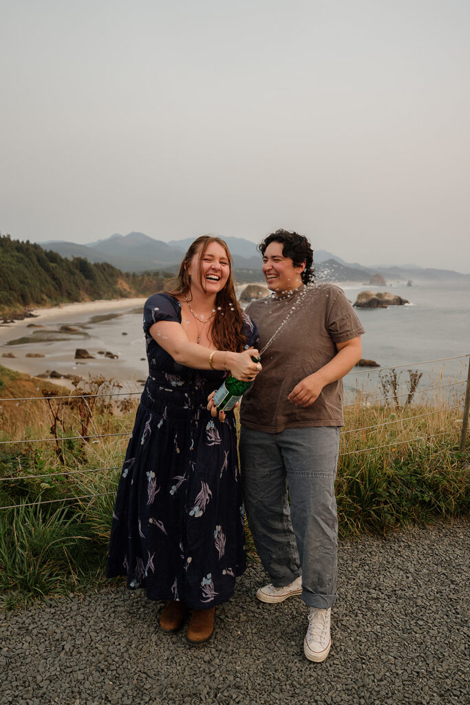Couple pops sparkling water after a surprise proposal at Ecola State Park