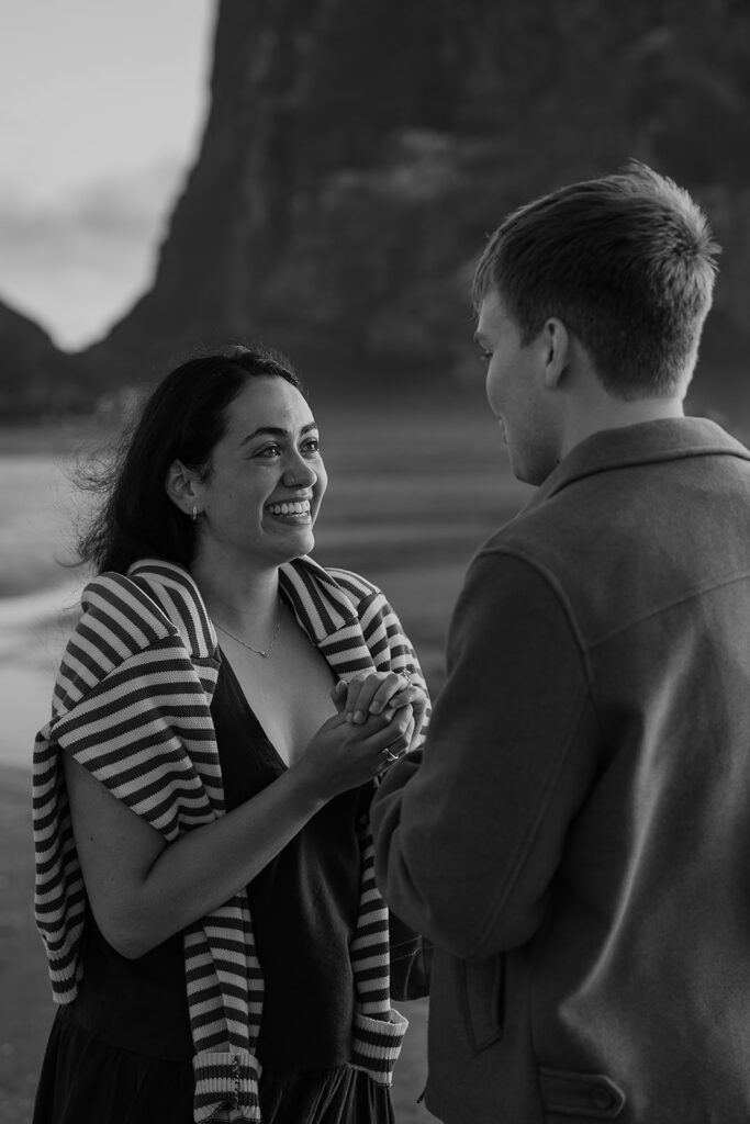 Surprise marriage proposal on Cannon Beach in front of Haystack Rock