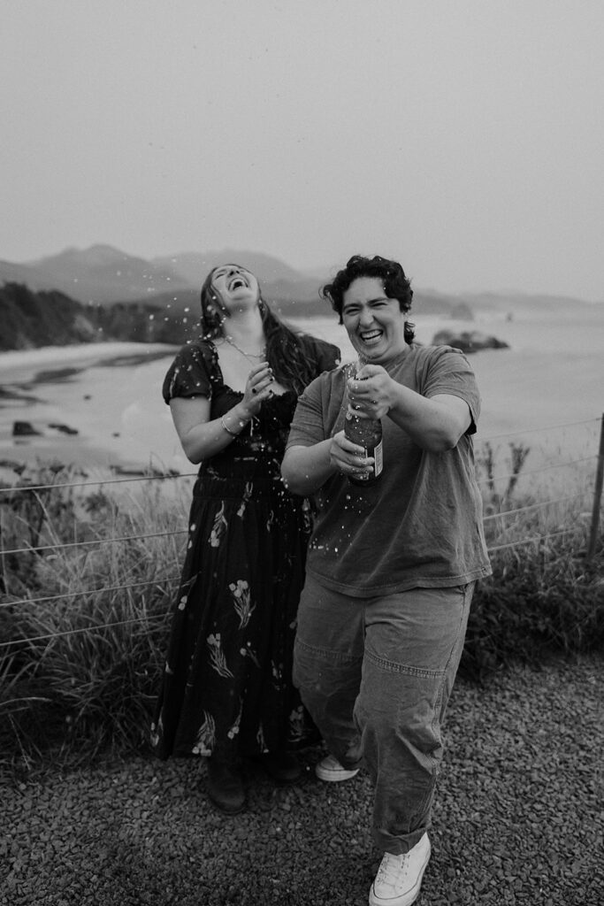 Couple pops sparkling water after a surprise proposal at Ecola State Park