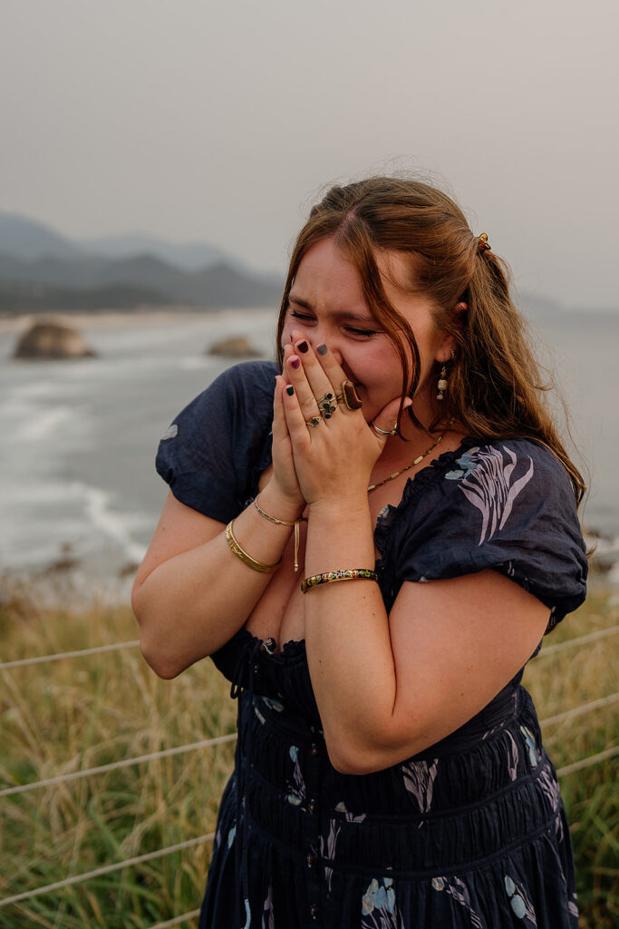 Girl in shock during a surprise proposal on the Oregon Coast